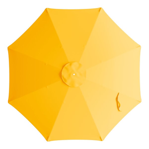 A yellow umbrella canopy for a round table with a white background.