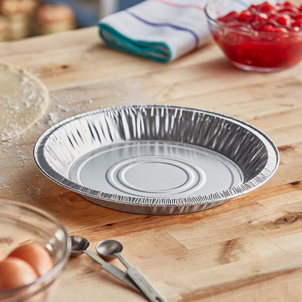 A Baker's Lane foil pie pan on a table with a pie.