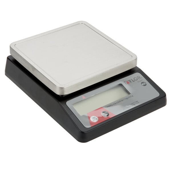 A black and silver Taylor digital portion scale on a counter.