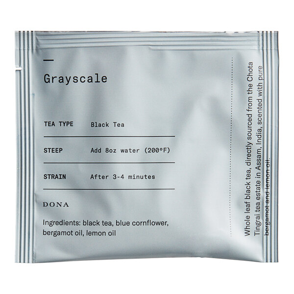 A white Dona Tea sachet packet with black text.