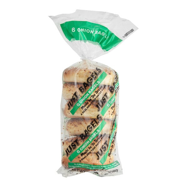 A plastic bag of Just Bagels Authentic New York Onion Bagels with green and white writing.