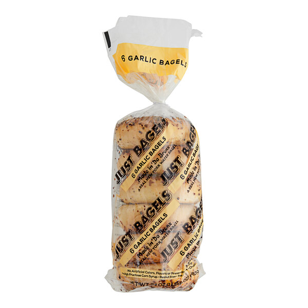 A plastic bag of Just Bagels Authentic New York Garlic Bagels.