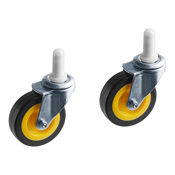 A pair of yellow caster wheels with black rubber.