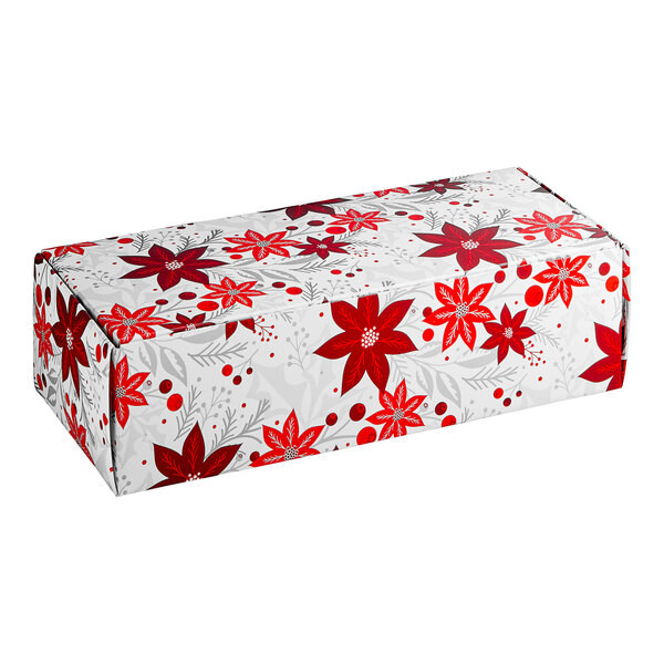 A white rectangular candy box with red poinsettias.