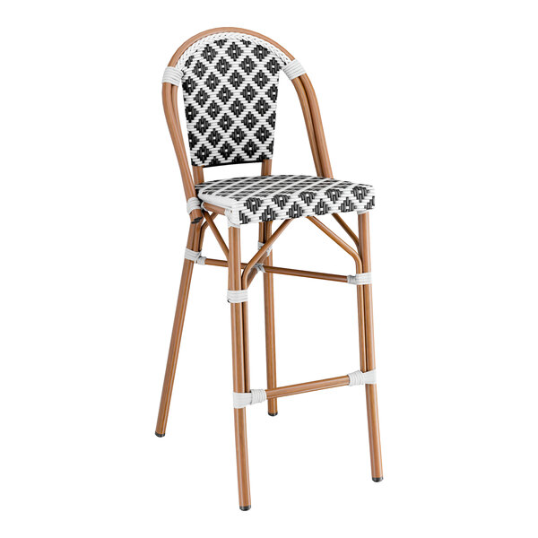 A Lancaster Table & Seating outdoor restaurant bar stool with a black and white birdseye weave rattan seat.