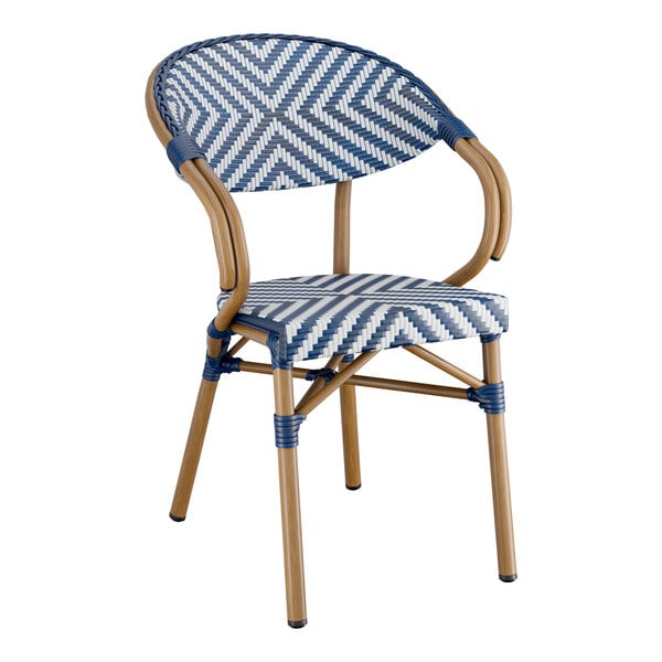 A navy and white chevron weave rattan arm chair.