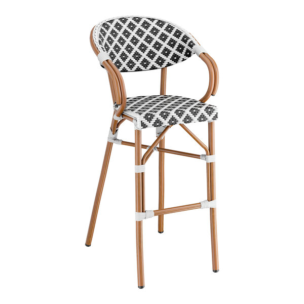 A Lancaster Table & Seating outdoor barstool with a black and white birdseye weave pattern on the seat.