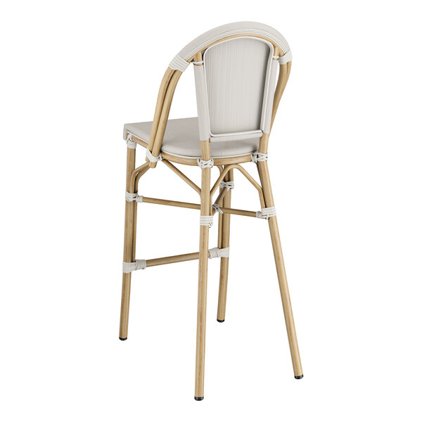 A Lancaster Table & Seating outdoor barstool with a gray Teslin seat and wooden frame.