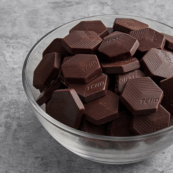 A bowl of TCHO Dark & Bitter 100% Dark Chocolate Hexagons.
