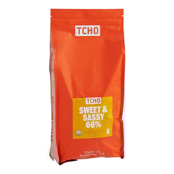 A close up of a bag of TCHO Sweet & Sassy 66% Dark Chocolate with white text.