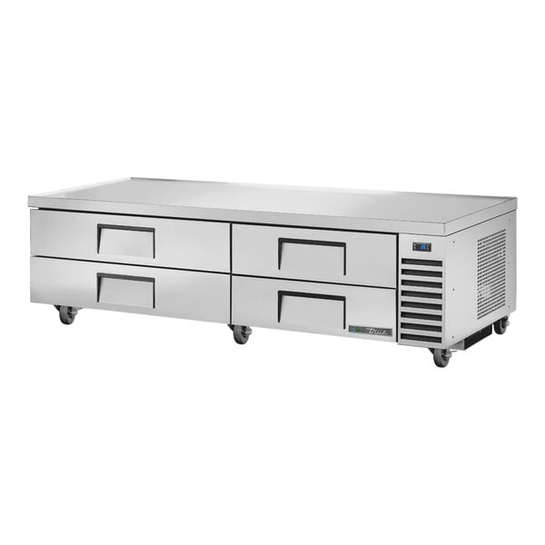 A stainless steel True refrigerated chef base with 4 drawers.