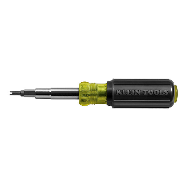 A black and yellow Klein Tools screwdriver with a green handle.