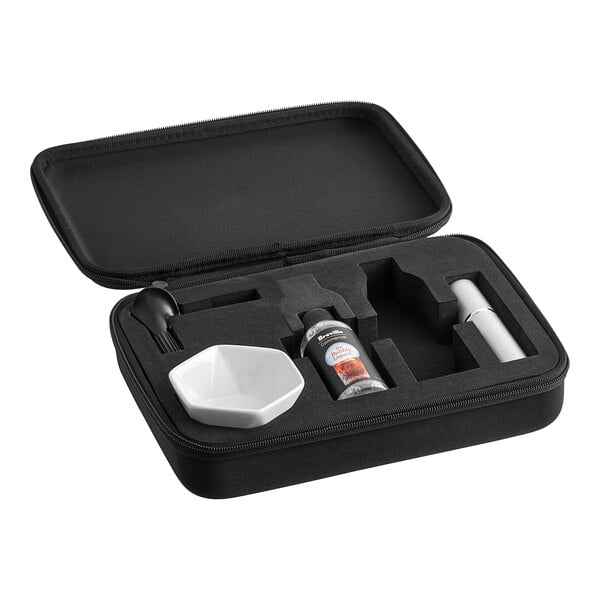 A black case with a white bowl and a bottle of liquid in it.