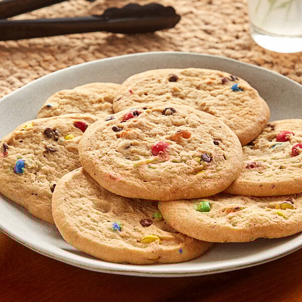 A plate of Otis Spunkmeyer Carnival cookies with colorful sprinkles.