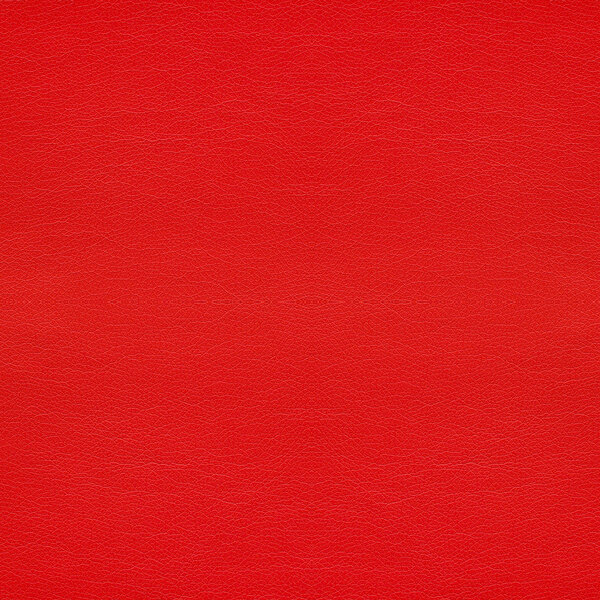 A red vinyl seat with a white border and small ripples.