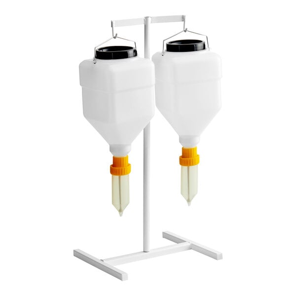 A white Asept 2-piece condiment dispenser set on a stand.