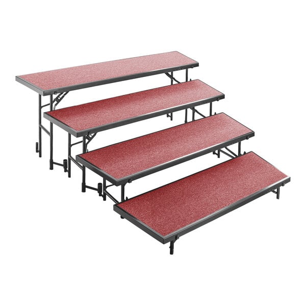 A National Public Seating red carpeted choral riser shelf.