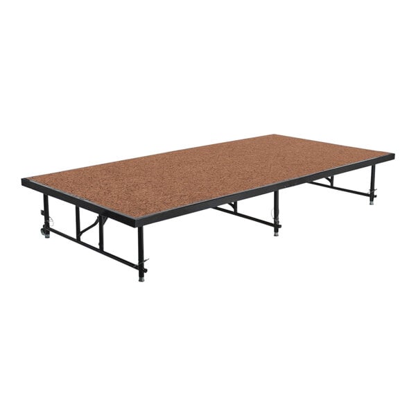 A National Public Seating stage platform with a wooden top.