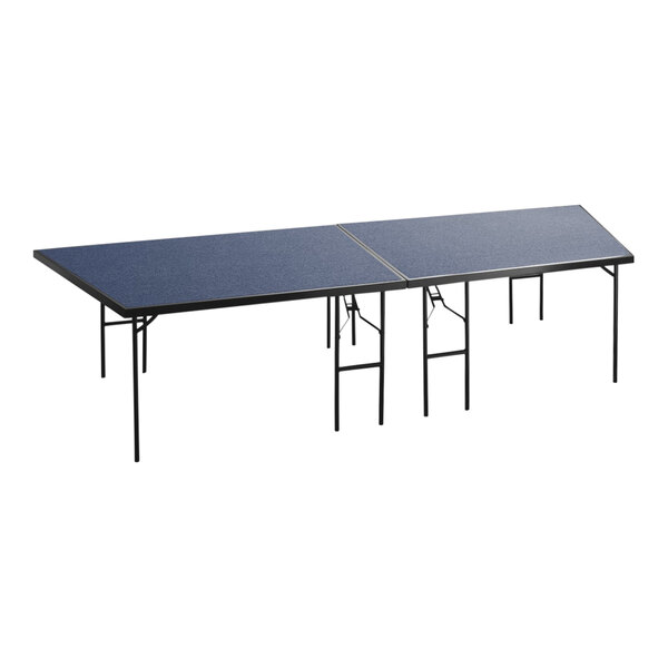 A National Public Seating stage pie with folding legs and a blue surface.