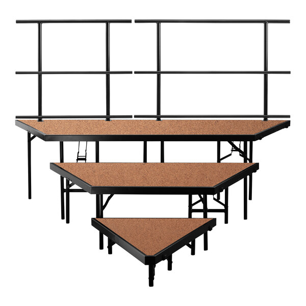 A group of National Public Seating 3-level stage risers with guardrails.