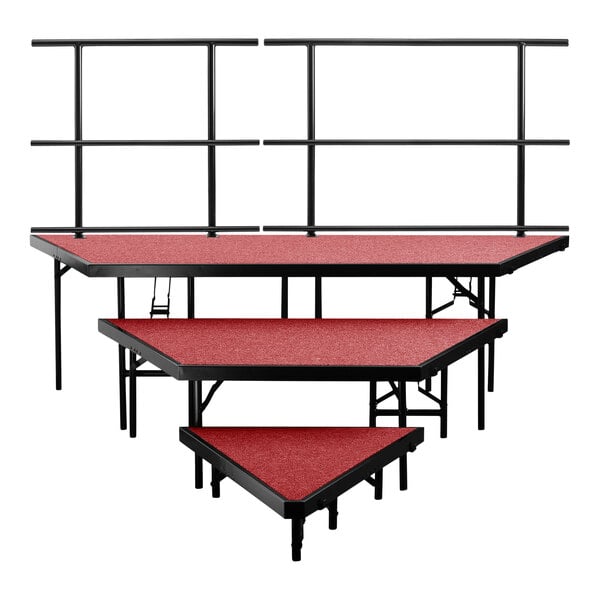 A red National Public Seating stage set with black metal railings.