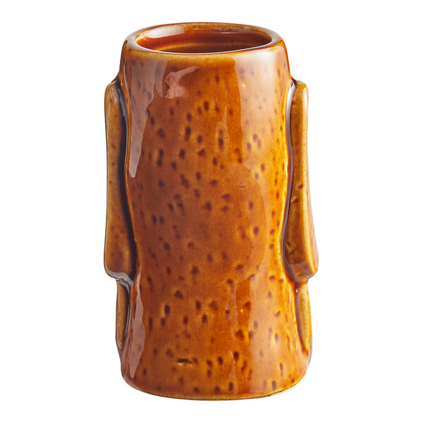 An Acopa brown ceramic tiki mug with a handle.