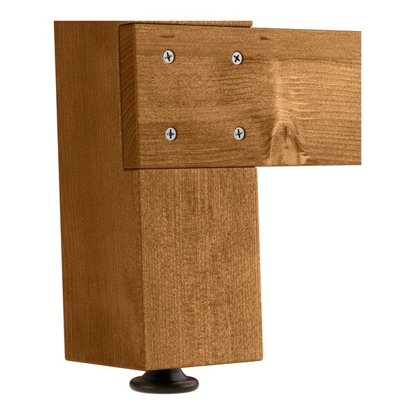 A Lancaster Table & Seating Vineyard Series outdoor table with two folding benches, all with a wooden brown surface.