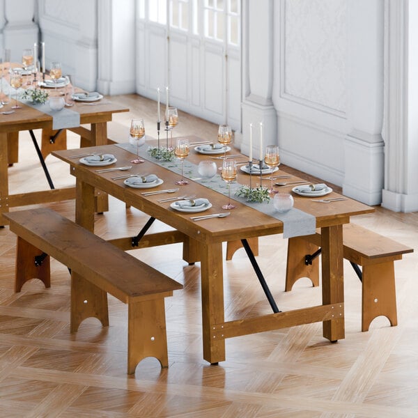 A Lancaster Table & Seating brown wooden table and bench set.