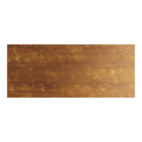 A brown wooden Lancaster Table & Seating Vineyard Series outdoor folding table with a wood surface and knots.