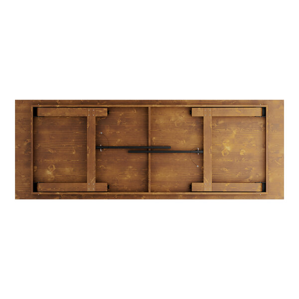 A Lancaster Table & Seating wooden barrel brown outdoor table with two folding benches.