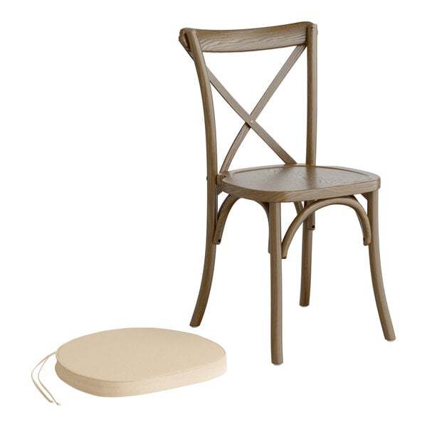 A Lancaster Table & Seating Vineyard Series Whiskey Brown outdoor cross back chair with a Chardonnay tan cushion on a white background.