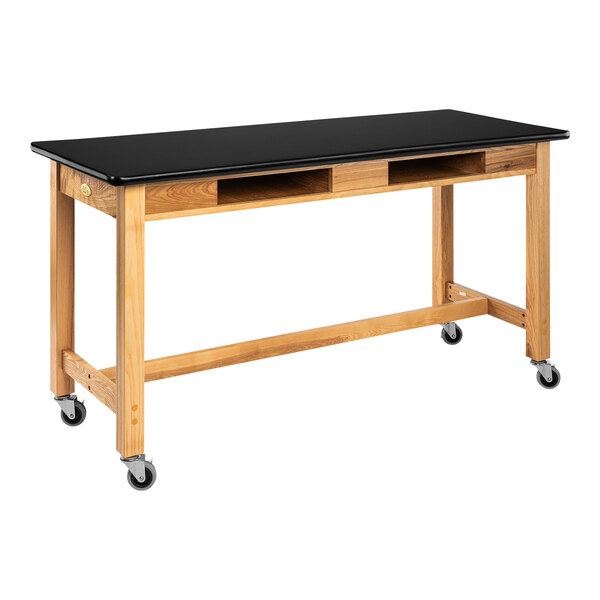 A black National Public Seating science lab table with casters.