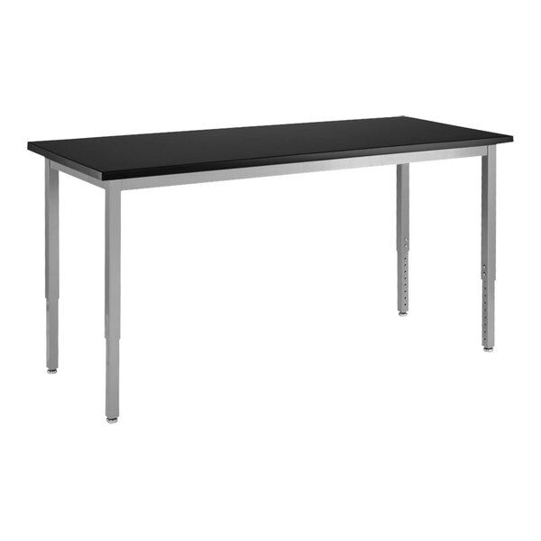 A black rectangular National Public Seating science lab table with silver legs.