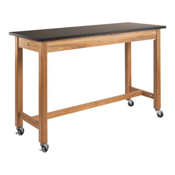 A National Public Seating wood science lab table with black chem-res top and wheels.