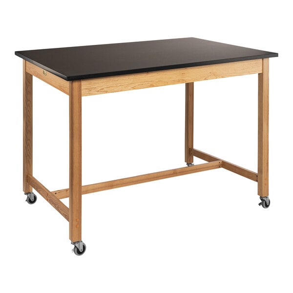 A black National Public Seating wood science lab table with casters.
