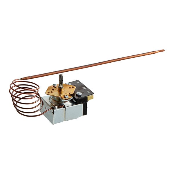 A small metal device with a copper wire coil and a metal rod.