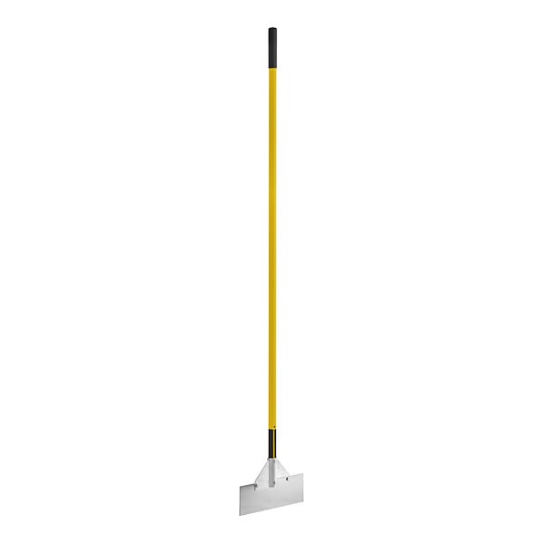 A white metal object with a yellow handle.