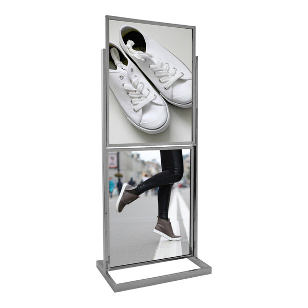 A rectangular tube framed double sign holder with a sign in it on a stand.