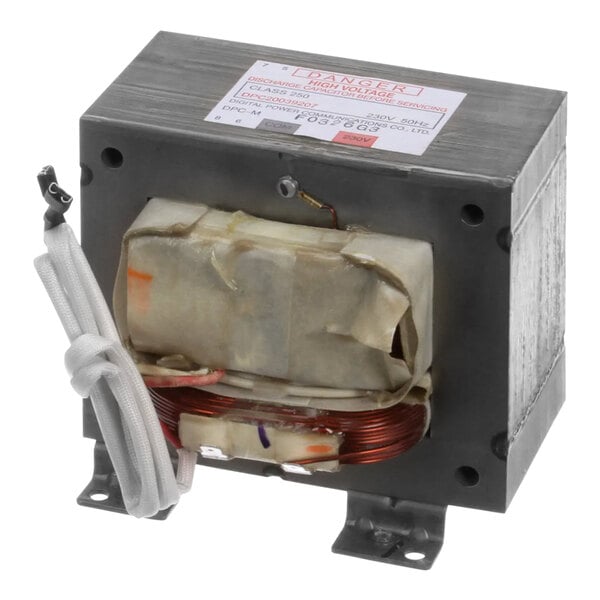 A white rectangular Amana Menumaster high voltage transformer with wires.