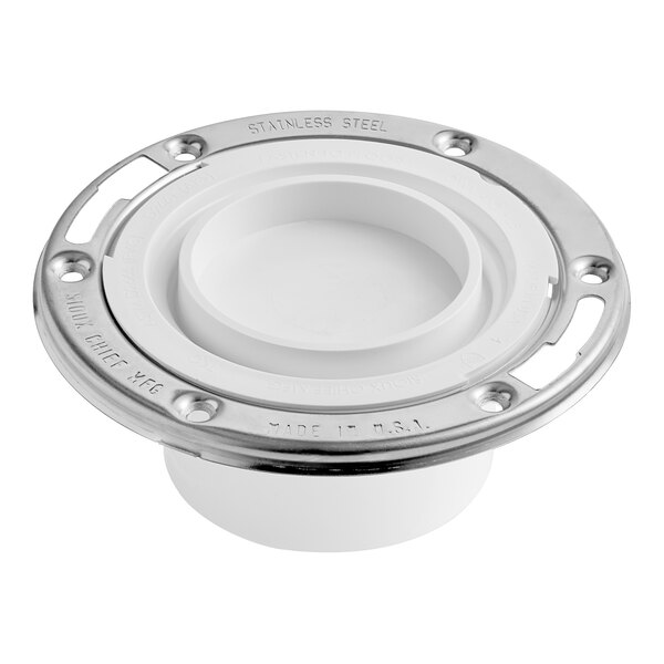 A white plastic Sioux Chief water closet flange with a stainless steel swivel ring.