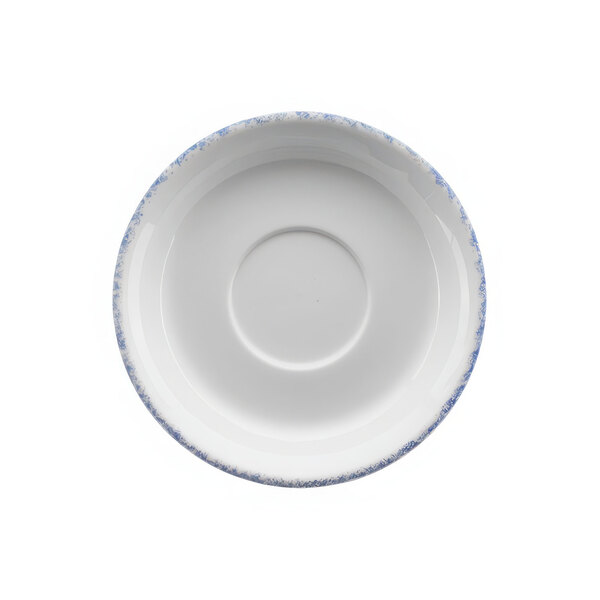 A white porcelain saucer with a blue and white circle design.