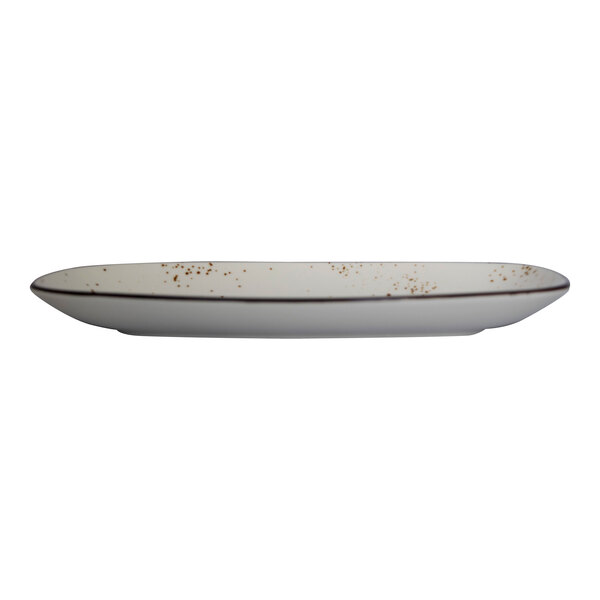 A white rectangular stoneware platter with brown speckled design.