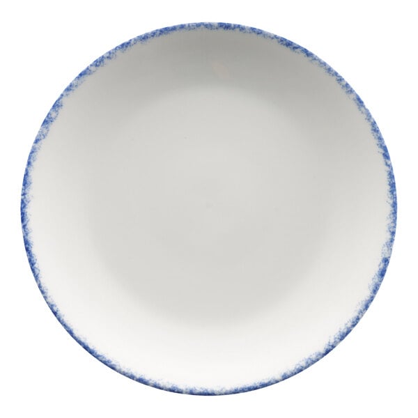 A white porcelain coupe plate with a blue sponged rim.