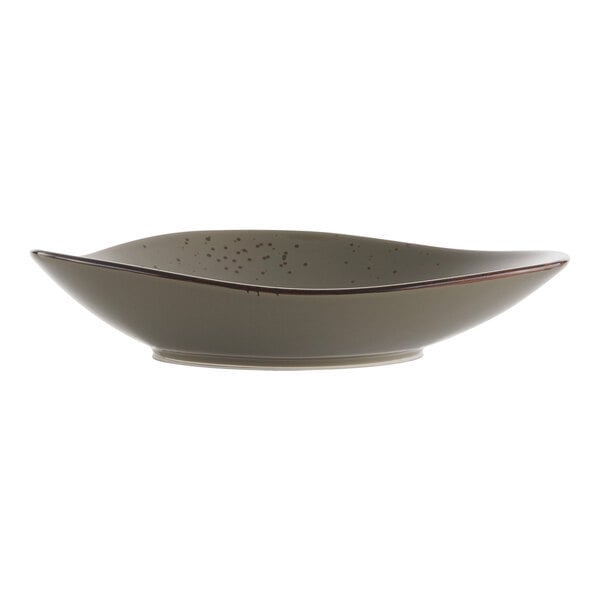 A white stoneware bowl with brown specks.
