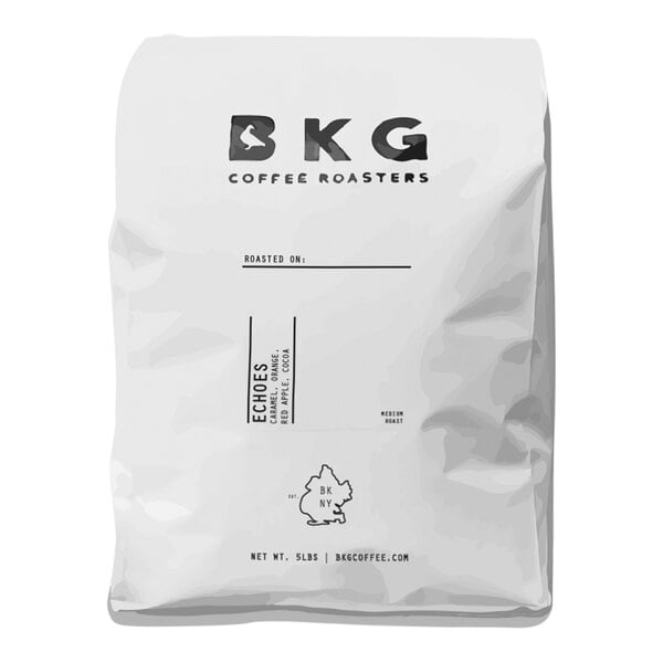 A white BKG Coffee Roasters bag of whole bean coffee with black text.