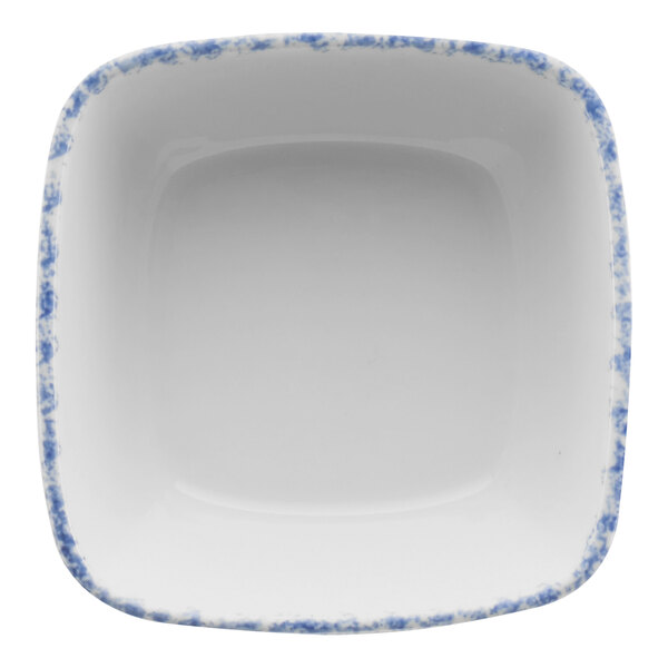 A white square porcelain bowl with a blue sponged border.