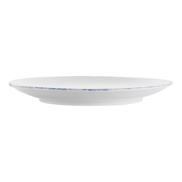 A close up of an International Tableware white porcelain coupe plate with blue trim.