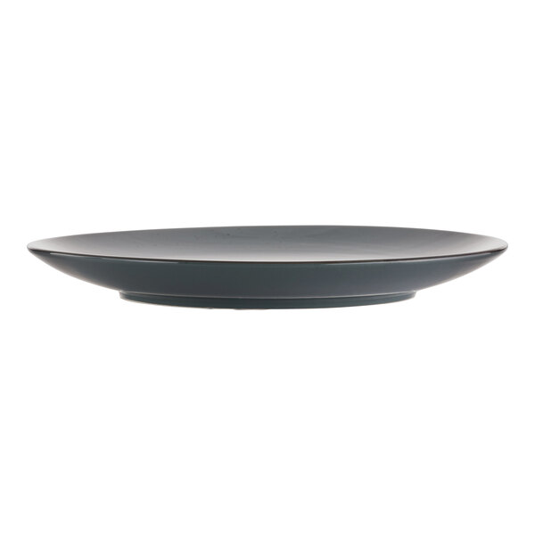 A black International Tableware stoneware coupe plate with a rim.