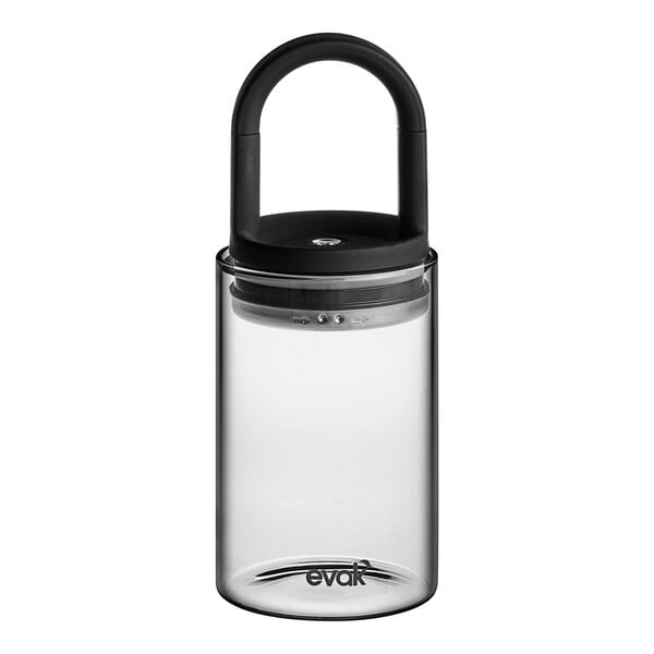A clear glass food storage container with a black lid.