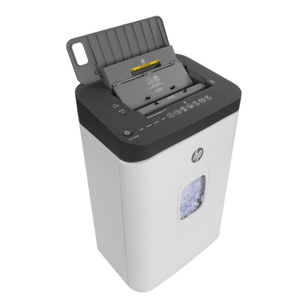 An HP micro-cut paper shredder with a paper tray in the top drawer.